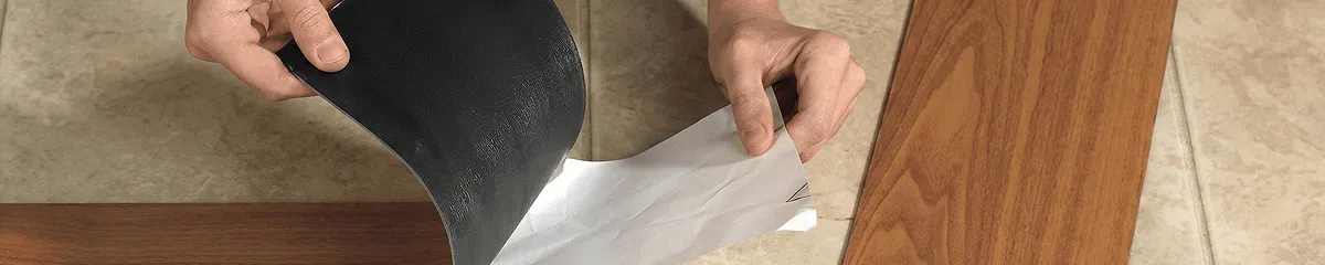 A professional installing vinyl flooring in Gilbert, AZ
